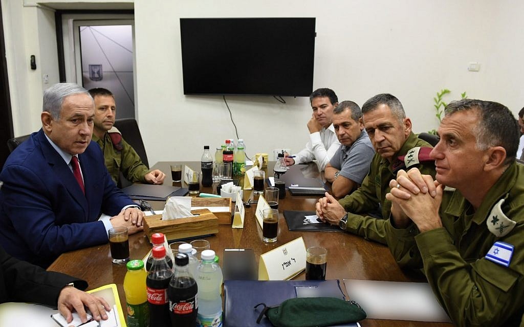 Prime Minister Benjamin Netanyahu (L) is seen with security chiefs at the IDF's Tel Aviv headquarters on September 10, 2019, hours after a rocket attack on Ashdod forced him to run for shelter during a campaign rally (Ariel Hermoni/Defense Ministry) Prime Minister Benjamin Netanyahu (L) is seen with security chiefs at the IDF's Tel Aviv headquarters on September 10, 2019, hours after a rocket attack on Ashdod forced him to run for shelter during a campaign rally (Ariel Hermoni/Defense Ministry)