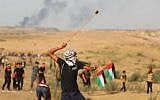 Illustrative: Palestinians clash with Israeli forces at a demonstration near the Shuja'iyya neighborhood of Gaza City, September 20, 2019. (Hassan Jedi/Flash90)