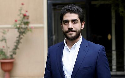 Abdullah Morsi, the youngest son of Egypt's jailed former Islamist President Mohammed Morsi, poses for a photograph in front of his home in Cairo, Egypt, September 30, 2018. (AP Photo/Brian Rohan, File)