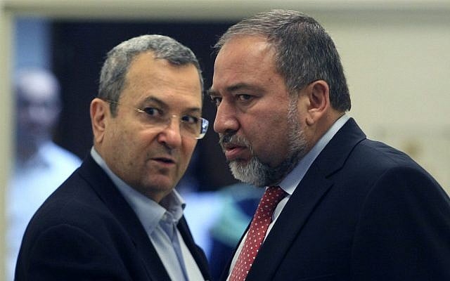 Then-defense minister Ehud Barak, left, and then-foreign minister Avigdor Liberman, right, arrive at a weekly cabinet meeting at the Prime Minister's office in Jerusalem, November 13, 2011. (Kobi Gideon/Flash90) Then-defense minister Ehud Barak, left, and then-foreign minister Avigdor Liberman, right, arrive at a weekly cabinet meeting at the Prime Minister's office in Jerusalem, November 13, 2011. (Kobi Gideon/Flash90)