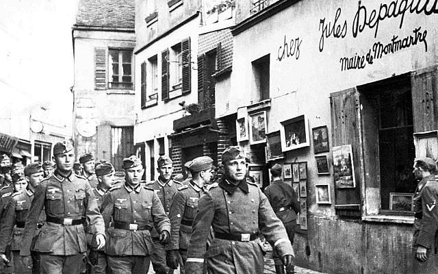 Nazi soldiers march through Paris, France, October 24, 1940. (AP)