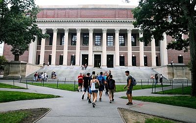 Students walk near the Widener Library in Harvard Yard at Harvard University in Cambridge, Massachusetts, August 13, 2019. (AP Photo/Charles Krupa, File)