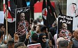 Former detainees of the pro-Israel South Lebanon Army (SLA) militia hold posters depicting former SLA member Amer al-Fakhoury during a demonstration denouncing his return and entry outside the Justice Palace in the Lebanese capital Beirut on September 12, 2019. (NWAR AMRO/AFP)