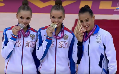 Israel's Linoy Ashram (R) with her all-around bronze medal at the rhythmic gymnastics world championships in Baku, Azerbaijan on September 20, 2019, alongside gold and silver medalists Dina (center) and Arina Averina of Russia. (Screenshot: YouTube)