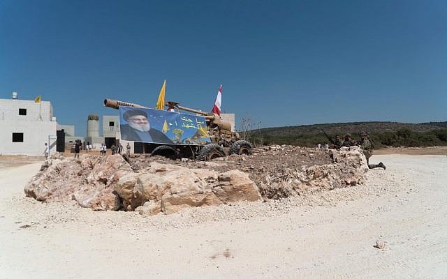 A Hezbollah poster and rocket launchers are seen in a mock Lebanese village as part of an IDF training program in September 2019. (Israel Defense Forces) A Hezbollah poster and rocket launchers are seen in a mock Lebanese village as part of an IDF training program in September 2019. (Israel Defense Forces)