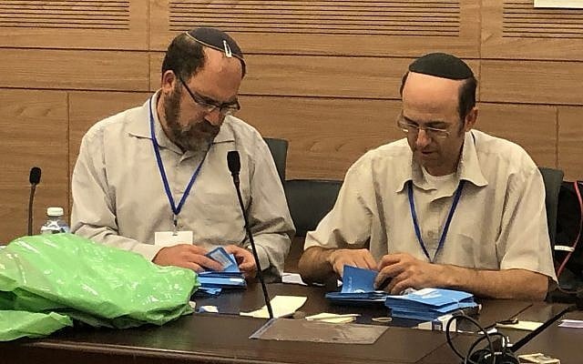 Lawyers at the Knesset in Jerusalem check votes cast during elections on September 17, in a final review prior to presentation of the results to President Reuven Rivlin, September 23, 2019. (Sue Surkes). Lawyers at the Knesset in Jerusalem check votes cast during elections on September 17, in a final review prior to presentation of the results to President Reuven Rivlin, September 23, 2019. (Sue Surkes).