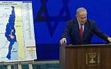 Prime Minister Benjamin Netanyahu delivering a campaign address next to a map of proposed areas of the West Bank for annexation on September 10, 2019. (screen capture: Facebook)
