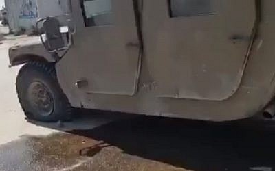 A military vehicle the IDF says was damaged when terrorists flew an armed drone across the border from Gaza into Israel, September 7, 2019 (Screen grab via Channel 13 news)