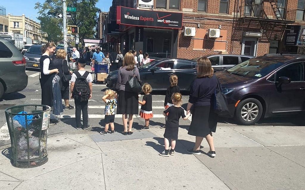 Women and children wait at a crosswalk in the Orthodox neighborhood of Borough Park, Brooklyn, Sept. 3, 2019. (Ben Sales/JTA) Women and children wait at a crosswalk in the Orthodox neighborhood of Borough Park, Brooklyn, Sept. 3, 2019. (Ben Sales/JTA)
