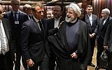 French President Emmanuel Macron (L) and Iranian President Hassan Rouhani speak after a meeting at the United Nations headquarters on September 23, 2019, in New York. (LUDOVIC MARIN / AFP)