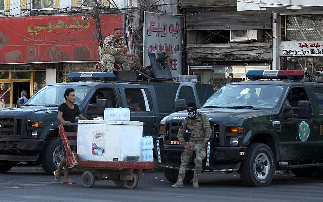 Iraqi security forces keep watch at Tahrir Square in central Baghdad on October 5, 2019, after a curfew was lifted following a day of violent protests. (Ahmad Al-Rubaye/AFP) Iraqi security forces keep watch at Tahrir Square in central Baghdad on October 5, 2019, after a curfew was lifted following a day of violent protests. (Ahmad Al-Rubaye/AFP)