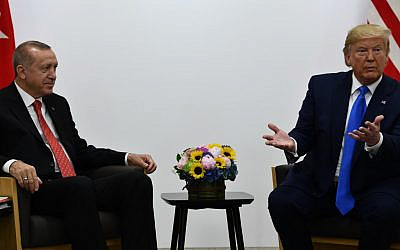 Illustrative: US President Donald Trump (R) and Turkish President Recep Tayyip Erdogan hold a bilateral meeting on the sidelines of the G20 Summit in Osaka on June 29, 2019. (Brendan Smialowski/AFP)
