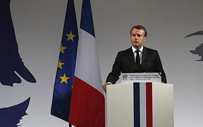 French President Emmanuel Macron speaks during a ceremony for the four victims of last weeks knife attack in the courtyard of the Paris police headquarters, on October 8, 2019 in Paris. - Frances presidency says the four victims of last weeks knife attack at the Paris police headquarters will be posthumously given Frances highest award, the Legion of Honor. (AP Photo/Francois Mori, Pool) (Photo by Francois Mori / POOL / AFP)