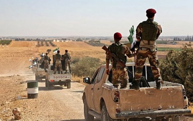 Turkish-backed Syrian rebel fighters head to an area near the Syrian-Turkish border north of Aleppo on October 8, 2019 (Nazeer Al-khatib / AFP) Turkish-backed Syrian rebel fighters head to an area near the Syrian-Turkish border north of Aleppo on October 8, 2019 (Nazeer Al-khatib / AFP)