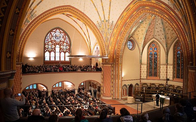 Mourners attend a vigil on October 10, 2019, in commemoration of the Halle shooting victims at the Pauluskirche church in Halle, eastern Germany, one day after the deadly anti-Semitic shooting. (Soeren Stache/DPA/AFP)