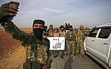Pro-Turkish Syrian fighters gather near the Turkish village of Akinci along the border with Syria on October 11, 2019. (Bakr ALKASEM / AFP)