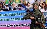 A member of the Kurdish Internal Security Force stands guard during a protest in the northern Syrian town of Hasakeh on October 12, 2019, against the Turkish offensives on Kurdish-held towns. (AFP)