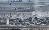 This picture taken on October 13, 2019 from the Turkish city of Ceylanpinar shows smoke rising and explosions in the Syrian border town of Ras al-Ayn as fighting rages along the border on the fifth day of a Turkish offensive in Syria (Ozan KOSE / AFP)