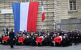 In this photo from October 8, 2019, police officers hold the coffins of their fallen colleagues during a ceremony at police headquarters in Paris, held to pay respects to the victims of a deadly stabbing attack at the prefecture on October 4, 2019. (Ludovic Marin/AFP)