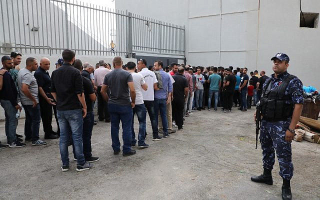 Palestinian football fans line up outside the stadium to watch a World Cup 2022 Asian qualifying match between Palestine and Saudi Arabia in the West Bank town of al-Ram on October 15, 2019. (HAZEM BADER/AFP) Palestinian football fans line up outside the stadium to watch a World Cup 2022 Asian qualifying match between Palestine and Saudi Arabia in the West Bank town of al-Ram on October 15, 2019. (HAZEM BADER/AFP)