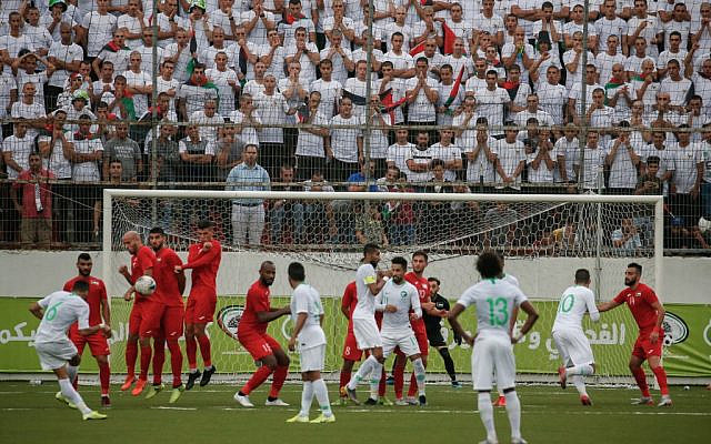 Saudi's defender Mohammed al-Breik takes a free kick during the World Cup 2022 Asian qualifying match between Palestine and Saudi Arabia in the town of al-Ram in the West Bank on October 15, 2019. (HAZEM BADER / AFP) Saudi's defender Mohammed al-Breik takes a free kick during the World Cup 2022 Asian qualifying match between Palestine and Saudi Arabia in the town of al-Ram in the West Bank on October 15, 2019. (HAZEM BADER / AFP)