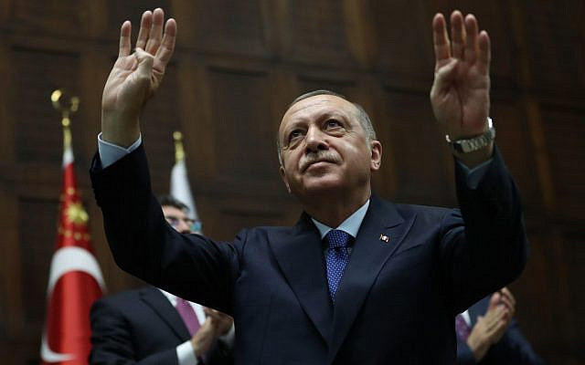 Turkish President Recep Tayyip Erdogan greets members of his Justice and Development (AK) Party during a meeting at the Turkish National Assembly in Ankara, Turkey, on October 16, 2019. (Adem Altan/AFP) Turkish President Recep Tayyip Erdogan greets members of his Justice and Development (AK) Party during a meeting at the Turkish National Assembly in Ankara, Turkey, on October 16, 2019. (Adem Altan/AFP)