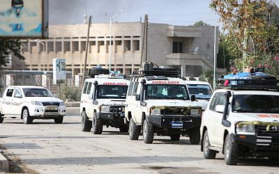 A convoy of ambulances evacuating fighters and injured members of the Kurdish-led Syrian Democratic Forces (SDF), as a well as wounded civilians, leaves the northeastern Syrian border town of Ras al-Ain on October 20, 2019. (Nazeer Al-Khatib/AFP)
