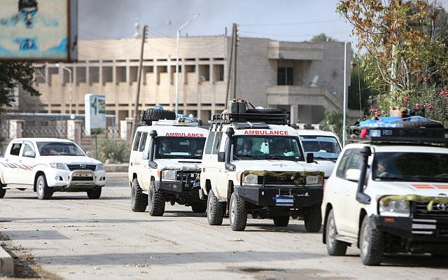 A convoy of ambulances evacuating fighters and injured members of the Kurdish-led Syrian Democratic Forces (SDF), as a well as wounded civilians, leaves the northeastern Syrian border town of Ras al-Ain on October 20, 2019. (Nazeer Al-Khatib/AFP) A convoy of ambulances evacuating fighters and injured members of the Kurdish-led Syrian Democratic Forces (SDF), as a well as wounded civilians, leaves the northeastern Syrian border town of Ras al-Ain on October 20, 2019. (Nazeer Al-Khatib/AFP)