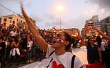 Lebanese demonstrators chant slogans as they take part in a rally in the capital Beirut's downtown district on October 20, 2019. (Photo by Anwar AMRO / AFP)