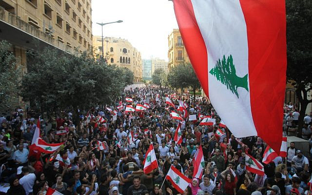 Lebanese demonstrators take part in a protest against dire economic conditions in Lebanon's southern city of Sidon on October 21, 2019. (IBRAHIM AMRO / AFP) Lebanese demonstrators take part in a protest against dire economic conditions in Lebanon's southern city of Sidon on October 21, 2019. (IBRAHIM AMRO / AFP)