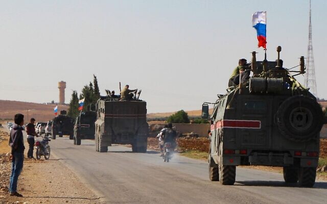 A convoy of Russian military vehicles drives toward the northeastern Syrian city of Kobane on October 23, 2019 (AFP) A convoy of Russian military vehicles drives toward the northeastern Syrian city of Kobane on October 23, 2019 (AFP)