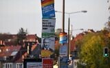 Different election campaign posters are fixed in a street in Erfurt, eastern Germany, on October 24, 2019. (Christof STACHE / AFP)