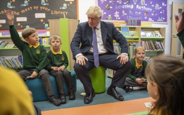 Britain's Prime Minister Boris Johnson speaks to pupils as he visits Middleton Primary School in Milton Keynes, southern England on October 25, 2019. (Paul Grover/Pool/AFP) Britain's Prime Minister Boris Johnson speaks to pupils as he visits Middleton Primary School in Milton Keynes, southern England on October 25, 2019. (Paul Grover/Pool/AFP)