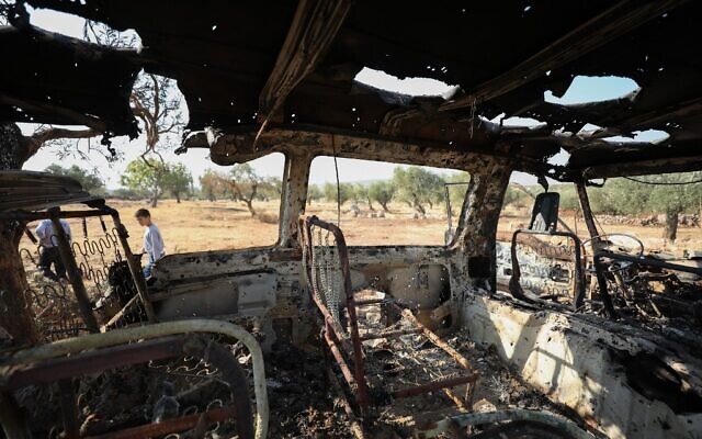 A picture taken on October 27, 2019 shows a burnt vehicle near the site where helicopter gunfire reportedly killed nine people near the northwestern Syrian village of Barisha in the province of Idlib near the border with Turkey, where 'groups linked to the Islamic State group' were present, according to a Britain-based war monitor with sources inside Syria (Omar HAJ KADOUR / AFP) A picture taken on October 27, 2019 shows a burnt vehicle near the site where helicopter gunfire reportedly killed nine people near the northwestern Syrian village of Barisha in the province of Idlib near the border with Turkey, where 'groups linked to the Islamic State group' were present, according to a Britain-based war monitor with sources inside Syria (Omar HAJ KADOUR / AFP)
