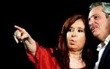 Argentina's former president and new vice president Cristina Fernandez waves at supporters next to president elect Alberto Fernandez, at the headquarters of the party in Buenos Aires on October 27, 2019. - Peronist candidate Alberto Fernandez won Argentina's presidential election in the first round on Sunday, official results showed, bringing to an end the crisis-plagued rule of market-friendly incumbent Mauricio Macri. (Photo by RONALDO SCHEMIDT / AFP)