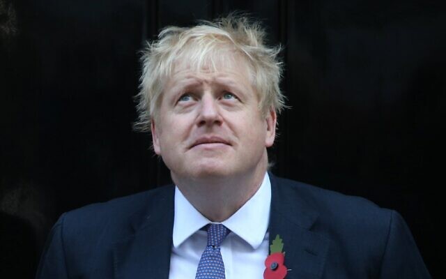 Britain's Prime Minister Boris Johnson looks up as he meets with fundraisers for the Royal British Legion outside 10 Downing street in central London on October 28, 2019 (ISABEL INFANTES / AFP) Britain's Prime Minister Boris Johnson looks up as he meets with fundraisers for the Royal British Legion outside 10 Downing street in central London on October 28, 2019 (ISABEL INFANTES / AFP)