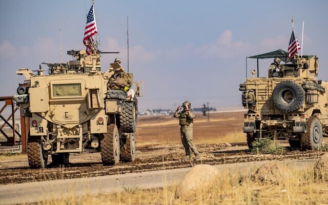 A convoy of US military vehicles drives through the Syrian northeastern town of Qahtaniyah on the border with Turkey on October 31, 2019 (Delil SOULEIMAN / AFP) A convoy of US military vehicles drives through the Syrian northeastern town of Qahtaniyah on the border with Turkey on October 31, 2019 (Delil SOULEIMAN / AFP)
