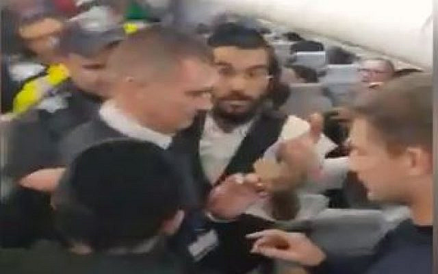 Israelis argue with security staff on a flight about to take off from Moldova. (Video screen-grab) Israelis argue with security staff on a flight about to take off from Moldova. (Video screen-grab)