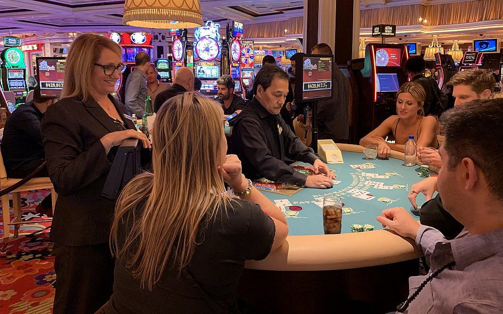 Orly Graves chats with customers as she monitors a blackjack table at the Wynn Las Vegas hotel, September 22, 2019. (Josefin Dolsten/JTA) Orly Graves chats with customers as she monitors a blackjack table at the Wynn Las Vegas hotel, September 22, 2019. (Josefin Dolsten/JTA)