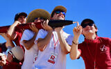 Daniel Shorr, far right, and other members of Stanford’s Student Space Initiative escort a rocket he built. (Courtesy of Shorr/via JTA)