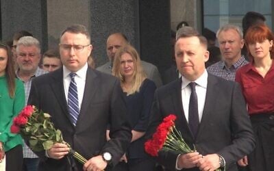 Alexander Vindman, left, the National Security Council Director for European Affairs, lays flowers to honor fallen Ukrainian soldiers in Kiev on May 21, 2019. (US Embassy in Kiev/Twitter)