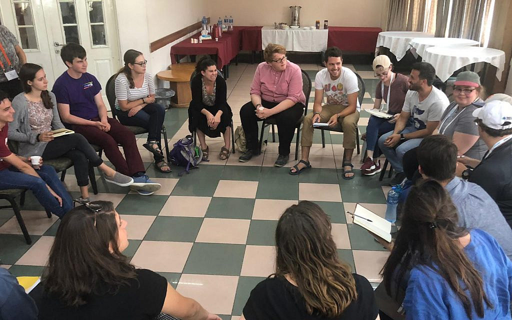 College students on J Street's summer trip to Israel and the West Bank participate in a group discussion, July 2019 (Courtesy)