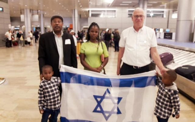 Agriculture Minister Uri Ariel (R) and former MK Avraham Neguise (L) welcome Meseret Warika and her two sons to Israel. Warika's brother Solomon Tekah was shot and killed by an off-duty policeman (courtesy) Agriculture Minister Uri Ariel (R) and former MK Avraham Neguise (L) welcome Meseret Warika and her two sons to Israel. Warika's brother Solomon Tekah was shot and killed by an off-duty policeman (courtesy)