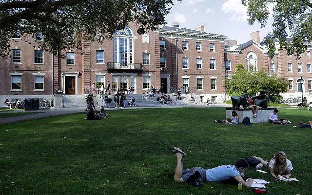 In this Wednesday, Sept. 25, 2019 photo people rest on grass while reading at Brown University, in Providence, Rhode Island (AP Photo/Steven Senne) In this Wednesday, Sept. 25, 2019 photo people rest on grass while reading at Brown University, in Providence, Rhode Island (AP Photo/Steven Senne)