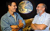 In this Thursday, Aug. 11, 2005 file photo Swiss Astronomers Michel Mayor, right, and Didier Queloz, left, pose for the photographer at the Astronomical Observatory of the University of Geneva. The 2019 Nobel prize in Physics was given to James Peebles "for theoretical discoveries in physical cosmology," and the other half jointly to Michel Mayor and Didier Queloz "for the discovery of an exoplanet orbiting a solar-type star," said Prof. Goran Hansson, secretary-general of the Royal Swedish Academy of Sciences that chooses the laureates. (Laurent Gillieron, Keystone via AP)