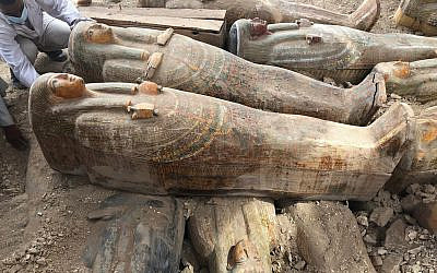 This photo provided by the Egyptian Ministry of Antiquities shows recently discovered ancient colored coffins with inscriptions and paintings, in the southern city of Luxor, Egypt, October 15, 2019. (Egyptian Ministry of Antiquities via AP)
