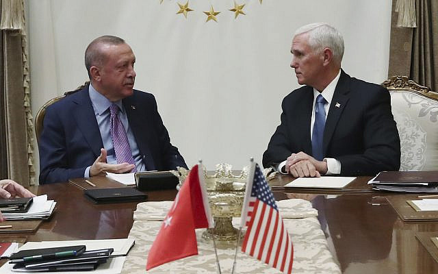 Turkey's President Recep Tayyip Erdogan, left, talks with US Vice President Mike Pence, during their meeting at the Presidential Palace in Ankara, Turkey, October 17, 2019. (Presidential Press Service via AP, Pool)