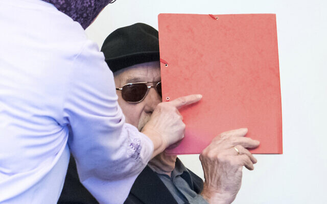 93-year-old former SS guard Bruno Dey in the concentration camp Stutthof near Danzig, arrives at the regional court in Hamburg, Germany, Monday, Oct. 21, 2019. The prosecution accuses the 93-year-old man of aiding and abetting the murder of 5,230 people. (Daniel Bockwoldt/dpa via AP) 93-year-old former SS guard Bruno Dey in the concentration camp Stutthof near Danzig, arrives at the regional court in Hamburg, Germany, Monday, Oct. 21, 2019. The prosecution accuses the 93-year-old man of aiding and abetting the murder of 5,230 people. (Daniel Bockwoldt/dpa via AP)