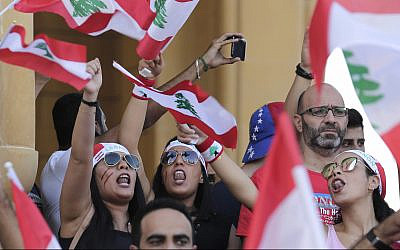 Anti-government protesters shout slogans against the Lebanese government during a protest in Beirut, Lebanon, October 21, 2019. (AP Photo/Hassan Ammar)