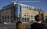 People walk by WeWork offices in Dublin, Ireland, October 6, 2019. (Mark Lennihan/AP)